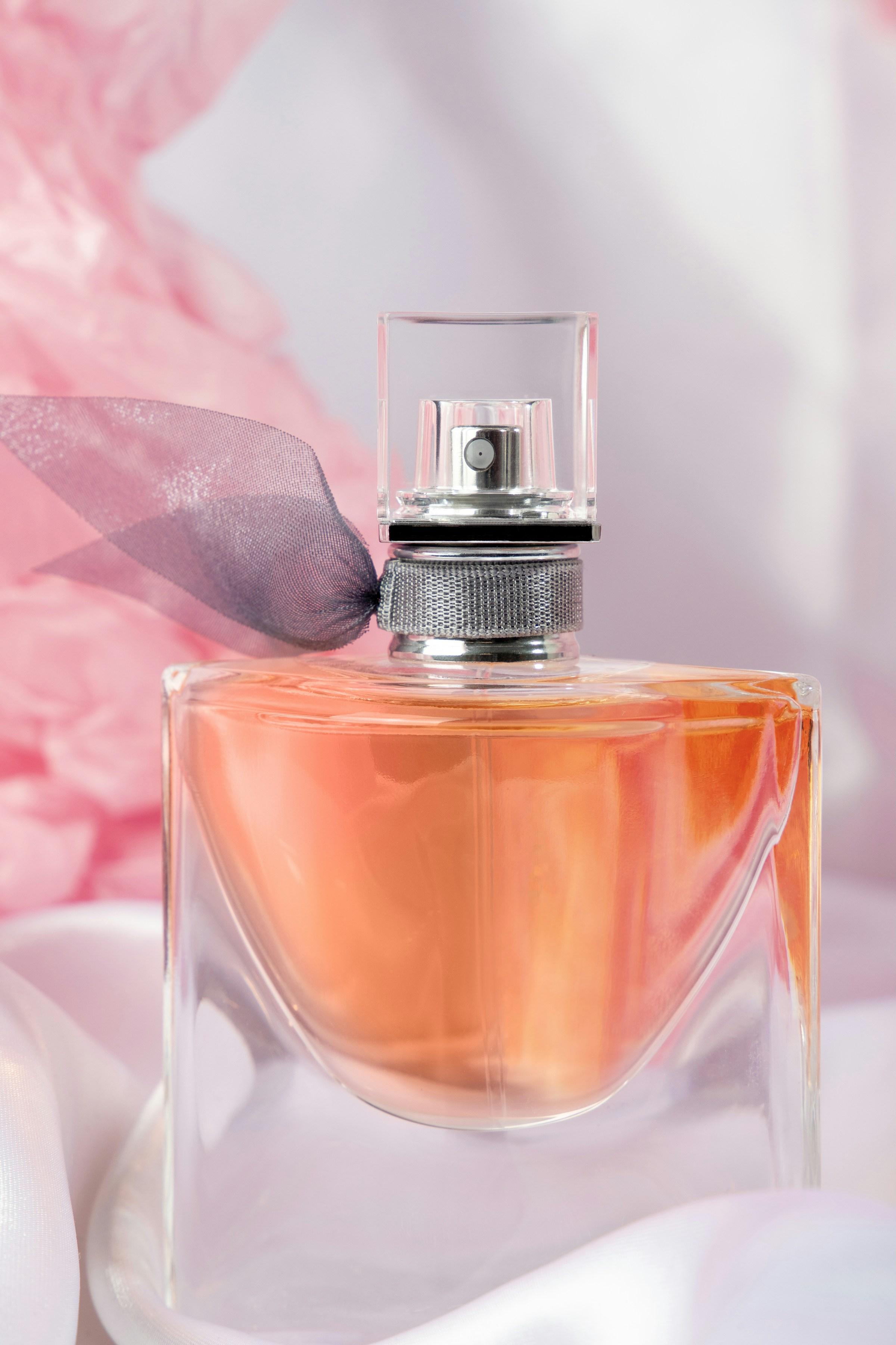 Luxury fragrance bottle with ribbon presentation